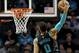 CHARLOTTE, NORTH CAROLINA - JANUARY 17: Harry Giles #20 of the Sacramento Kings watches as Miles Bridges #0 of the Charlotte Hornets dunks the ball during their game at Spectrum Center on January 17, 2019 in Charlotte, North Carolina. NOTE TO USER: User expressly acknowledges and agrees that, by downloading and or using this photograph, User is consenting to the terms and conditions of the Getty Images License Agreement. (Photo by Streeter Lecka/Getty Images)