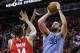 HOUSTON, TEXAS - JANUARY 14: Marc Gasol #33 of the Memphis Grizzlies shoots over Gerald Green #14 of the Houston Rockets during the fourth quarter at Toyota Center on January 14, 2019 in Houston, Texas. NOTE TO USER: User expressly acknowledges and agrees that, by downloading and or using this photograph, User is consenting to the terms and conditions of the Getty Images License Agreement. (Photo by Bob Levey/Getty Images)