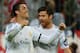 Real Madrid's Portuguese forward Cristiano Ronaldo (L) celebrates scoring the 0-3 with Real Madrid's midfielder Xabi Alonso during the UEFA Champions League second-leg semi-final football match FC Bayern Munich vs Real Madrid CF in Munich, southern Germany, on April 29, 2014. AFP PHOTO / JOHN MACDOUGALL (Photo credit should read JOHN MACDOUGALL/AFP/Getty Images)