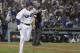 Los Angeles Dodgers' Manny Machado watches his single to deep left during the sixth inning in Game 3 of the World Series baseball game against the Boston Red Sox on Friday, Oct. 26, 2018, in Los Angeles. (AP Photo/David J. Phillip)