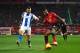 MANCHESTER, ENGLAND - JANUARY 19: Marcus Rashford of Manchester United controls the ball under pressure from Pascal Gross of Brighton and Hove Albion before scoring his team's second goal during the Premier League match between Manchester United and Brighton & Hove Albion at Old Trafford on January 19, 2019 in Manchester, United Kingdom. (Photo by Gareth Copley/Getty Images)