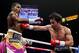 Manny Pacquiao, right, hits Adrien Broner during their WBA welterweight title boxing match Saturday, Jan. 19, 2019, in Las Vegas. (AP Photo/John Locher)