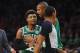 Boston Celtics guard Marcus Smart (36) is restrained by center Al Horford during the second half of the team's NBA basketball game against the Atlanta Hawks on Saturday, Jan. 19, 2019, in Atlanta. (AP Photo/Todd Kirkland)