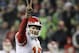 Kansas City Chiefs quarterback Patrick Mahomes signals the 2-point conversion attempt during the second half of an NFL football game against the Seattle Seahawks, Sunday, Dec. 23, 2018, in Seattle. The Chiefs scored on the play. (AP Photo/Elaine Thompson)