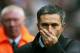 Manchester, UNITED KINGDOM: Chelsea's Manager Jose Mourinho arrives on the pitch before the game against Manchester United in the Premiership football match at Old Trafford in Manchester 06 November 2005. Manchester United won the game 1-0. AFP PHOTO ADRIAN DENNIS Mobile and website uses of domestic English football pictures subject to subscription of a license with Football Association Premier League (FAPL) tel : +44 207 298 1656. For newspapers where the football content of the printed and electronic versions are identical, no licence is necessary. (Photo credit should read ADRIAN DENNIS/AFP/Getty Images)