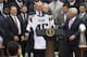 US President Donald Trump holds a jersey given to him by New England Patriots owner Robert Kraft (R) and head coach Bill Belichick (L) alongside members of the team during a ceremony honoring them as 2017 Super Bowl Champions on the South Lawn of the White House in Washington, DC, April 19, 2017. / AFP PHOTO / SAUL LOEB (Photo credit should read SAUL LOEB/AFP/Getty Images)