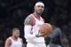 File- This Nov. 2, 2018, file photo shows Houston Rockets forward Carmelo Anthony reacting during the second half of an NBA basketball game in New York.  A person with knowledge of the situation says the Houston Rockets are trading Carmelo Anthony and an undisclosed amount of cash to the Chicago Bulls, in a deal that is expected to be completed Tuesday, Jan. 22, 2019. Anthony will not wind up playing for the Bulls, said the person who spoke to The Associated Press on condition of anonymity because nothing can be finalized until the league office approves the deal. (AP Photo/Mary Altaffer, File)