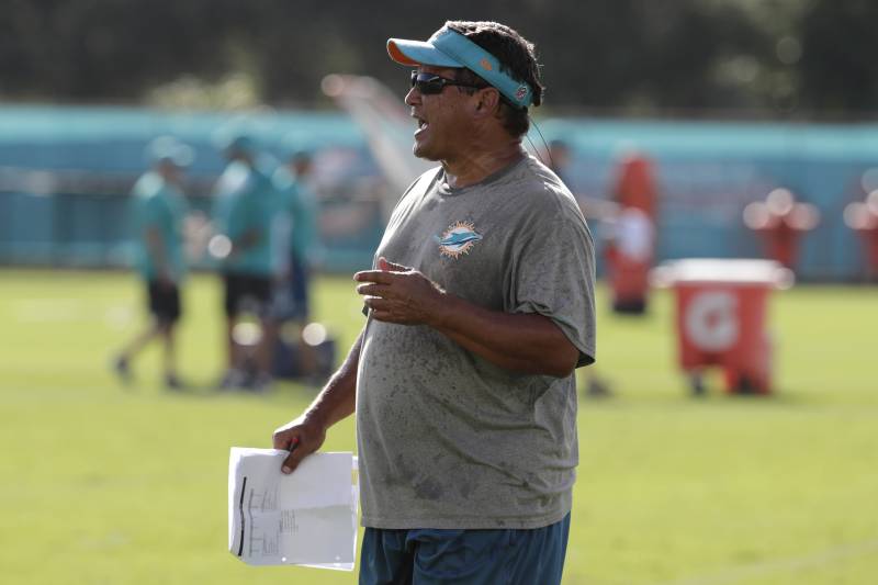 Miami Dolphins offensive coordinator Dowell Loggains watches at the NFL football team's training camp, Friday, July 27, 2018, in Davie, Fla. (AP Photo/Lynne Sladky)