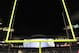 Officials guard the goalpost after fans rushed onto the field after Washington upset Stanford in an NCAA college football game, Thursday, Sept. 27, 2012, in Seattle. (AP Photo/Ted S. Warren)