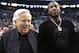 Rapper Meek Mill, right, stands with New England Patriots football team owner Robert Kraft at their seats for Game 2 of an NBA basketball second-round playoff series between the Boston Celtics and the Philadelphia 76ers, Thursday, May 3, 2018, in Boston. (AP Photo/Elise Amendola)