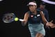 Japan's Naomi Osaka makes a forehand return to Karolina Pliskova of the Czech Republic during their semifinal at the Australian Open tennis championships in Melbourne, Australia, Thursday, Jan. 24, 2019. (AP Photo/Andy Brownbill)