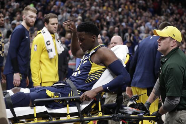 Indiana Pacers guard Victor Oladipo is taken off the court on a stretcher after he was injured during the first half of the team's NBA basketball game against the Toronto Raptors in Indianapolis, Wednesday, Jan. 23, 2019. (AP Photo/Michael Conroy)