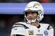 FOXBOROUGH, MASSACHUSETTS - JANUARY 13: Philip Rivers #17 of the Los Angeles Chargers reacts during the fourth quarter in the AFC Divisional Playoff Game against the New England Patriots at Gillette Stadium on January 13, 2019 in Foxborough, Massachusetts. (Photo by Elsa/Getty Images)
