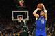 MILWAUKEE, WISCONSIN - JANUARY 21: Luka Doncic #77 of the Dallas Mavericks takes a shot during a game against the Milwaukee Bucks at Fiserv Forum on January 21, 2019 in Milwaukee, Wisconsin. NOTE TO USER: User expressly acknowledges and agrees that, by downloading and or using this photograph, User is consenting to the terms and conditions of the Getty Images License Agreement. (Photo by Stacy Revere/Getty Images)