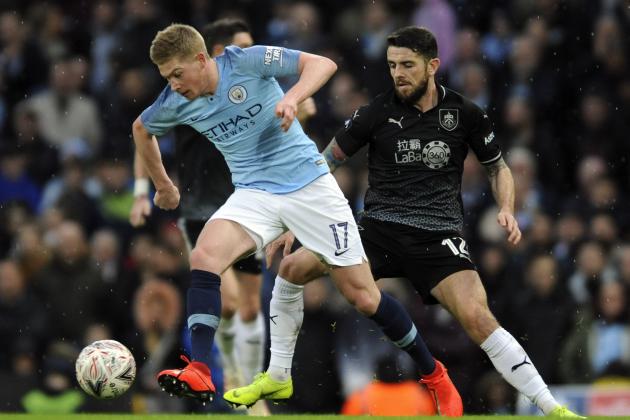 Manchester City's Kevin De Bruyne, left, and Burnley's Robbie Brady challenge for the ball during the English Premier League soccer match between Manchester City and Burnley at Etihad stadium in Manchester, England, Saturday, Jan. 26, 2019. (AP Photo/Rui Vieira)