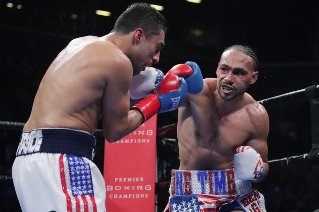 Keith Thurman, right, punches Josesito Lopez during the fifth round of a welterweight championship boxing match Saturday, Jan. 26, 2019, in New York. Thurman won the fight. (AP Photo/Frank Franklin II)