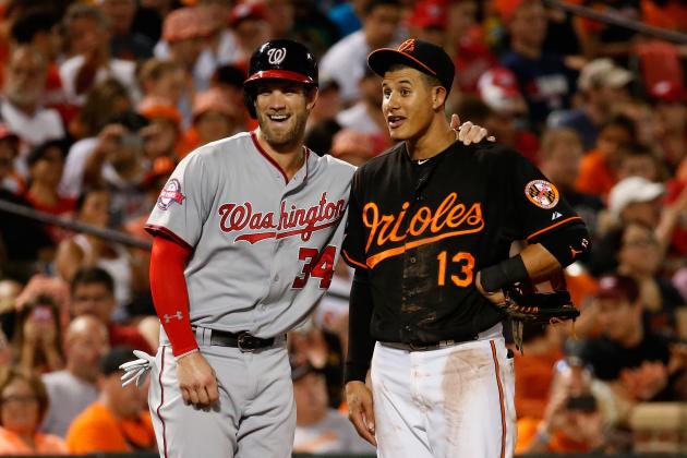 BALTIMORE, MD - JULY 10: Bryce Harper #34 of the Washington Nationals and Manny Machado #13 of the Baltimore Orioles talk during their game at Oriole Park at Camden Yards on July 10, 2015 in Baltimore, Maryland. (Photo by Rob Carr/Getty Images)