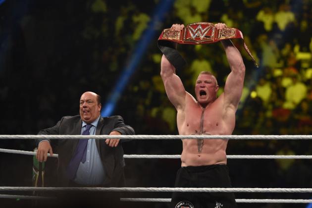 Brock Lesnar celebrates, with his manager Paul Heyman, after winning the WWE Universal Championship match as part of as part of the World Wrestling Entertainment (WWE) Crown Jewel pay-per-view at the King Saud University Stadium in Riyadh on November 2, 2018. (Photo by Fayez Nureldine / AFP) (Photo credit should read FAYEZ NURELDINE/AFP/Getty Images)