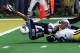 Tennessee Titans wide receiver Kevin Dyson (87) tries but fails to get the ball into the end zone as he is tackled by St. Louis Rams' Mike Jones on the final play of Super Bowl XXXIV on Sunday, Jan. 30, 2000, in Atlanta. The Rams won 23-16. (AP Photo/John Gaps III)
