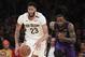 New Orleans Pelicans' Anthony Davis dribbles the ball past Los Angeles Lakers' LeBron James during the second half of an NBA basketball game Friday, Dec. 21, 2018, in Los Angeles. The Lakers won 112-104. (AP Photo/Jae C. Hong)