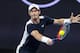 MELBOURNE, AUSTRALIA - JANUARY 14: Andy Murray of Great Britain hits a backhand in his first round match against Roberto Bautista Agut of Spain during day one of the 2019 Australian Open at Melbourne Park on January 14, 2019 in Melbourne, Australia. (Photo by TPN/Getty Images)
