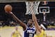 Philadelphia 76ers center Joel Embiid, center, shoots as Los Angeles Lakers center JaVale McGee, right, defends during the first half of an NBA basketball game Tuesday, Jan. 29, 2019, in Los Angeles. (AP Photo/Mark J. Terrill)