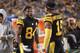 Pittsburgh Steelers wide receiver Antonio Brown (84) taks with wide receiver JuJu Smith-Schuster (19) on the sideline during the second half of an NFL football game against the Carolina Panthers in Pittsburgh, Thursday, Nov. 8, 2018. (AP Photo/Keith Srakocic)