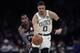 Boston Celtics forward Jayson Tatum (0) outruns Brooklyn Nets forward Rondae Hollis-Jefferson (24) during the second half of an NBA basketball game in Boston, Monday, Jan. 28, 2019. The Celtics won 112-104. (AP Photo/Charles Krupa)