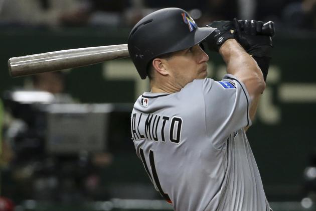 MLB All-Star catcher J.T. Realmuto of the Miami Marlins hits a solo home-run off Yomiuri Giants pitcher Ryusei Oe in the fifth inning of their exhibition baseball game at Tokyo Dome in Tokyo, Thursday, Nov. 8, 2018. (AP Photo/Toru Takahashi)