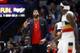 New Orleans Pelicans forward Anthony Davis talks to guard Jrue Holiday, foreground, in the second half of an NBA basketball game in New Orleans, Wednesday, Jan. 23, 2019. The Pistons won 98-94. (AP Photo/Gerald Herbert)