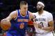 New York Knicks forward Kristaps Porzingis (6) drives against New Orleans Pelicans forward Anthony Davis (23) during the first half of an NBA basketball game in New Orleans, Saturday, Dec. 30, 2017. (AP Photo/Jonathan Bachman)