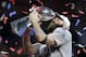 New England Patriots' Julian Edelman holds the trophy after the NFL Super Bowl 53 football game against the Los Angeles Rams, Sunday, Feb. 3, 2019, in Atlanta. The Patriots won 13-3. Edelman was named the Most Valuable Player.(AP Photo/John Bazemore)