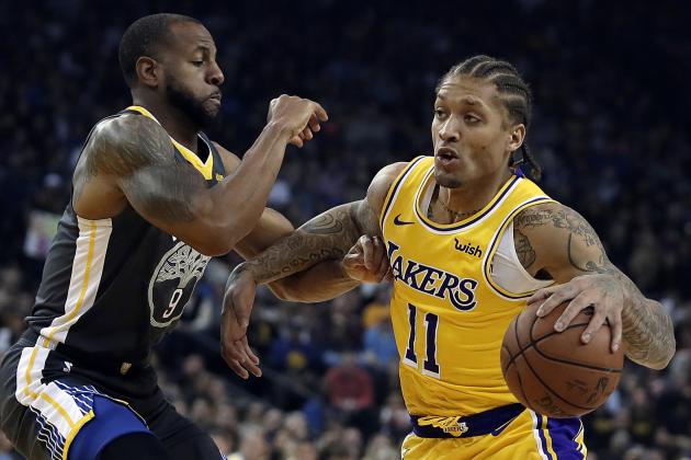 Los Angeles Lakers' Michael Beasley, right, drives the ball against Golden State Warriors' Andre Iguodala (9) in the first half of an NBA basketball game Saturday, Feb. 2, 2019, in Oakland, Calif. (AP Photo/Ben Margot)