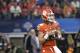 Clemson quarterback Trevor Lawrence (16) drops back to pass during the NCAA Cotton Bowl semi-final playoff football game against Notre Dame on Saturday, Dec. 29, 2018, in Arlington, Texas. (AP Photo/ Jeffrey McWhorter)