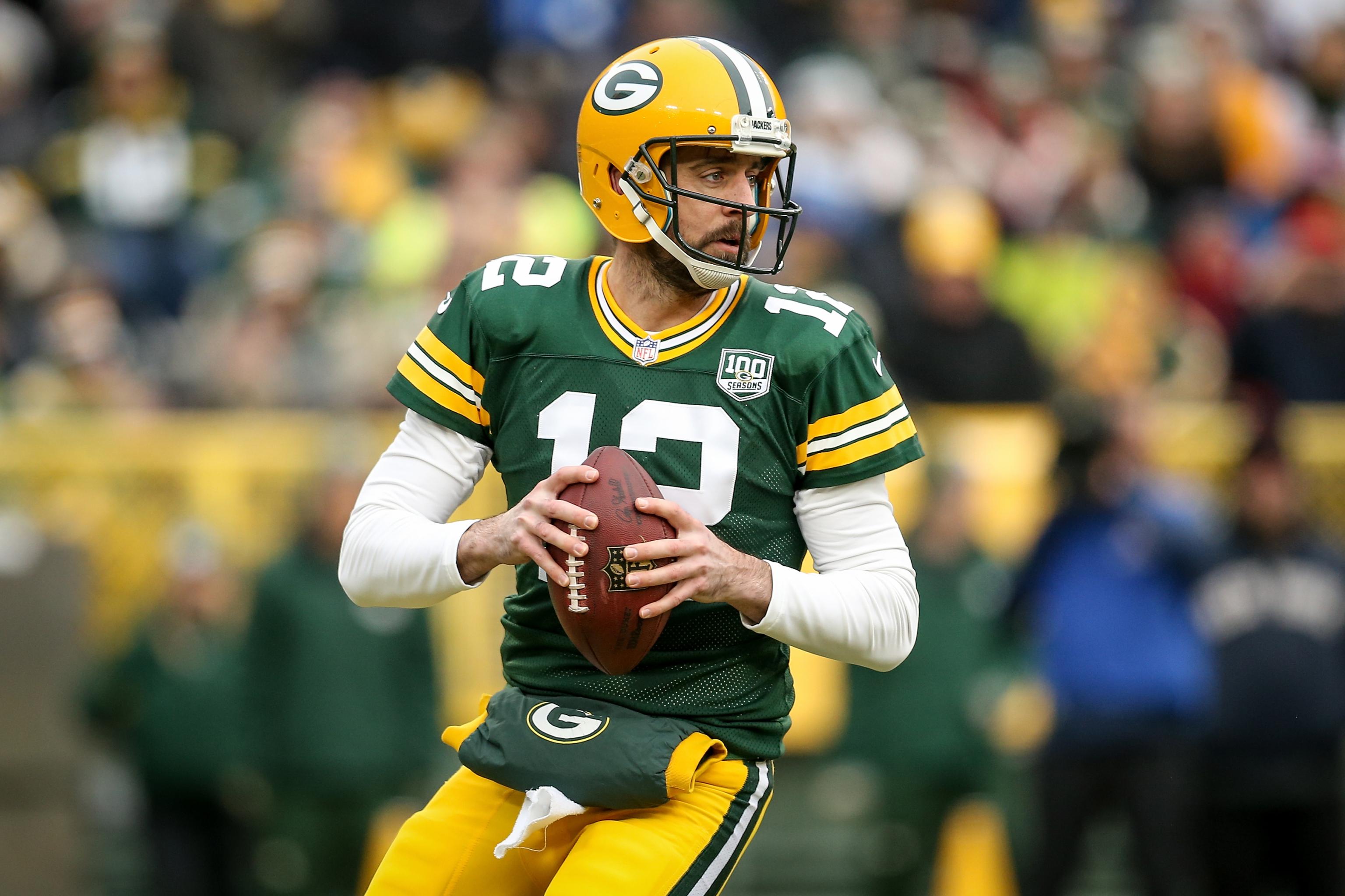 Green Bay Packers Aaron Rodgers takes a knee after being sacked