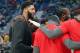 New Orleans Pelicans forward Anthony Davis huddles with teammates on the court before an NBA basketball game against the Indiana Pacers in New Orleans, Monday, Feb. 4, 2019. (AP Photo/Gerald Herbert)