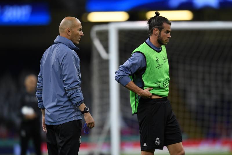 CARDIFF, WALES - JUNE 02: Head coach Zinedine Zidane (L) and Gareth Bale of Real Madrid look on during a training session ahead of the UEFA Champions League final between Juventus and Real Madrid at the National Stadium of Wales on June 2, 2017 in Cardiff, Wales. (Photo by Etsuo Hara/Getty Images)