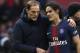 SG coach Thomas Tuchel, left, speaks with PSG's Edinson Cavani as he leaves the pitch during the French League One soccer match between Paris Saint-Germain and Bordeaux at the Parc des Princes stadium in Paris, Saturday, Feb. 9, 2019. (AP Photo/Christophe Ena)