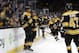 Patrice Bergeron and Brad Marchand celebrate after the Bruins beat the Kings in overtime.