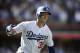 Los Angeles Dodgers' Cody Bellinger watches the flight of his two-run home run during the fourth inning of a tiebreaker baseball game against the Colorado Rockies, Monday, Oct. 1, 2018, in Los Angeles. (AP Photo/Jae C. Hong)