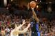 CHARLOTTESVILLE, VA - FEBRUARY 09: RJ Barrett #5 of the Duke Blue Devils shoots over Kyle Guy #5 of the Virginia Cavaliers in the first half during a game at John Paul Jones Arena on February 9, 2019 in Charlottesville, Virginia. (Photo by Ryan M. Kelly/Getty Images)