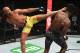 MELBOURNE, AUSTRALIA - FEBRUARY 10: (L-R) Anderson Silva of Brazil kicks Israel Adesanya of New Zealand in their middleweight bout during the UFC 234 at Rod Laver Arena on February 10, 2019 in the Melbourne, Australia. (Photo by Jeff Bottari/Zuffa LLC/Zuffa LLC via Getty Images)