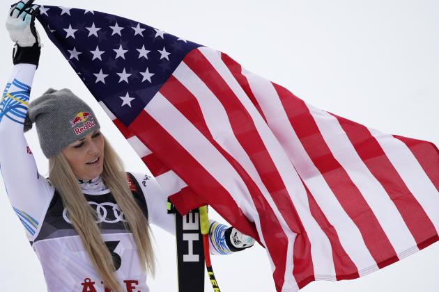 Third placed United States' Lindsey Vonn celebrates on the podium after the women's downhill race, at the alpine ski World Championships in Are, Sweden, Sunday, Feb. 10, 2019. (AP Photo/Giovanni Auletta)