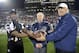 Official Ron Turner (82) and Orlando Apollos vice president of player personnel Bill Kuharich, right, pose with Apollo VII astronaut Walter Cunningham before an Alliance of American Football game between the Apollos and the Atlanta Legends on Saturday, Feb. 9, 2019, in Orlando, Fla. (AP Photo/Phelan M. Ebenhack)