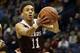 Missouri State's Jarred Dixon (11) heads to the basket past Northern Iowa's Jeremy Morgan during the second half of an NCAA college basketball game in the quarterfinals of the Missouri Valley Conference men's tournament Friday, March 3, 2017, in St. Louis. Missouri State won 70-64. (AP Photo/Jeff Roberson)