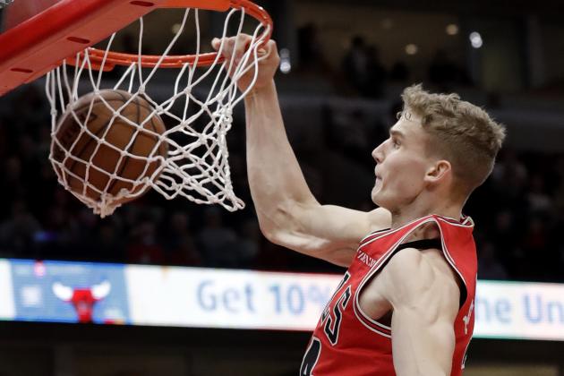 Chicago Bulls forward Lauri Markkanen dunks against the Washington Wizards during the second half of an NBA basketball game Saturday, Feb. 9, 2019, in Chicago. (AP Photo/Nam Y. Huh)