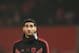 (FILES) This file photo taken on December 5, 2018 shows Manchester United's Belgian midfielder Marouane Fellaini warming up for the English Premier League football match between Manchester United and Arsenal at Old Trafford in Manchester, north west England. - Marouane Fellaini should brace for a culture shock at Chinese club Shandong Luneng following his move from Premier League Manchester United.The 31-year-old -- known as 'Fluffy Head' in China, although he now has short hair -- on February 1, 2019 became the latest player to swap Europe for the Chinese Super League on big money. (Photo by OLI SCARFF / AFP) (Photo credit should read OLI SCARFF/AFP/Getty Images)