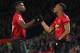 Manchester United's French striker Anthony Martial celebrates with Manchester United's French midfielder Paul Pogba (L) after scoring their second goal during the English Premier League football match between Manchester United and Everton at Old Trafford in Manchester, north west England, on October 28, 2018. (Photo by Paul ELLIS / AFP) / RESTRICTED TO EDITORIAL USE. No use with unauthorized audio, video, data, fixture lists, club/league logos or 'live' services. Online in-match use limited to 120 images. An additional 40 images may be used in extra time. No video emulation. Social media in-match use limited to 120 images. An additional 40 images may be used in extra time. No use in betting publications, games or single club/league/player publications. / (Photo credit should read PAUL ELLIS/AFP/Getty Images)