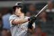 FILE - In this Tuesday, Aug. 14, 2018 file photo, Miami Marlins' J.T. Realmuto follows through on two-run base hit in the fourth inning of a baseball game against the Atlanta Braves in Atlanta. A person familiar with the negotiations says Miami Marlins All-Star catcher J.T. Realmuto has been traded to the Philadelphia Phillies for catcher Jorge Alfaro, two pitching prospects and international bonus pool allocation. The person confirmed the trade to The Associated Press on condition of anonymity Thursday, Feb. 7, 2019 because the teams had not announced it. (AP Photo/John Bazemore, File)