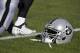 An Oakland Raiders helmet is on the playing field before an NFL football game against the Kansas City Chiefs in Kansas City, Mo., Sunday, Dec. 10, 2017. (AP Photo/Ed Zurga)